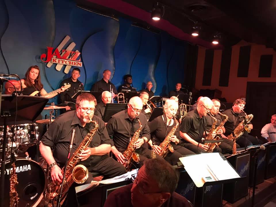 Large Joy Swing big band performing live on stage