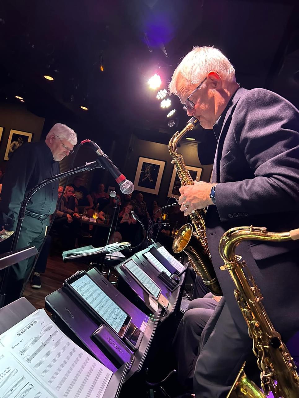 JoySwing saxophonist performing beside the bandstand