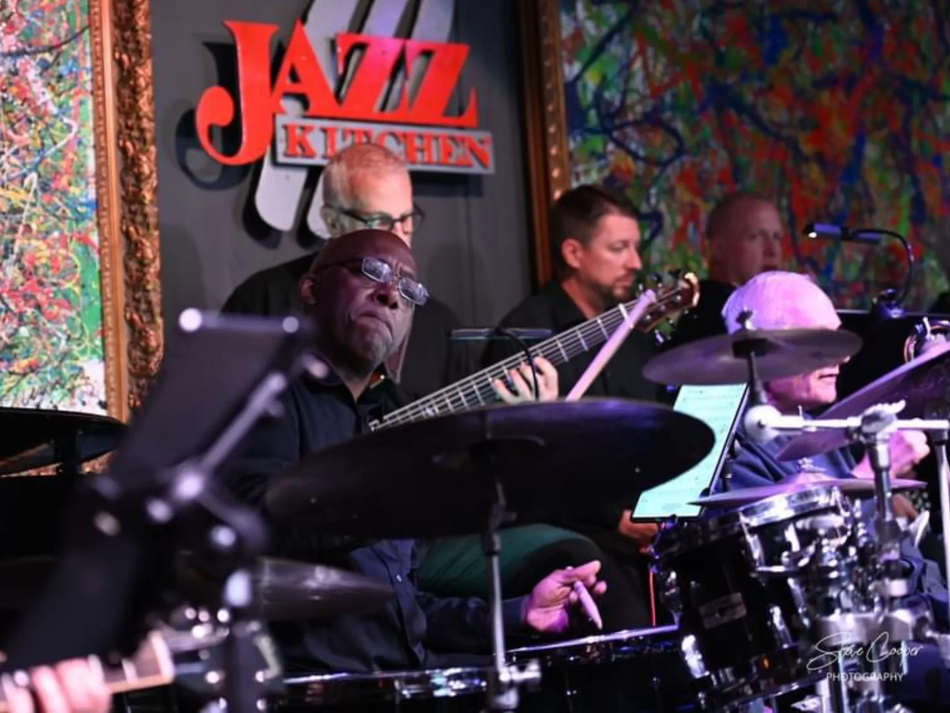 JoySwing bassist and drummer performing on stage